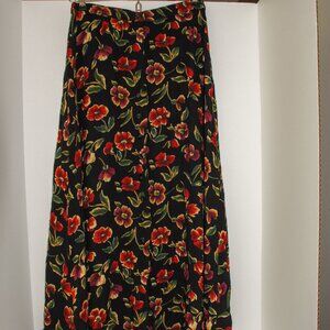 Jones New York A line skirt. Black with red floral pattern Size small.